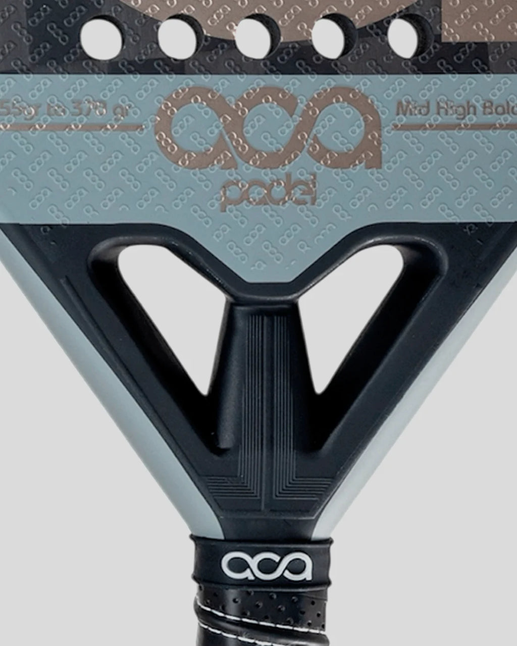 Close-up of a pickleball paddle with 'ACA' branding on a gray background