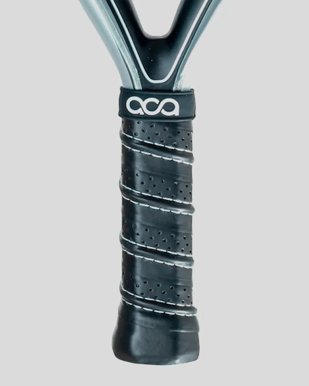 Close-up of a padel racket handle with a black grip and visible branding on a light gray background