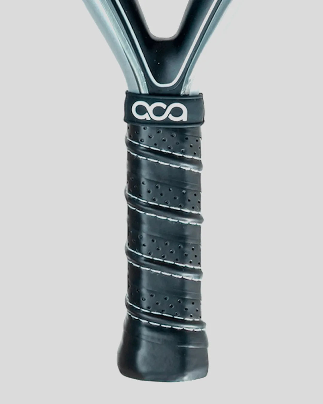 Close-up of a padel racket handle with a black grip and visible branding on a light gray background