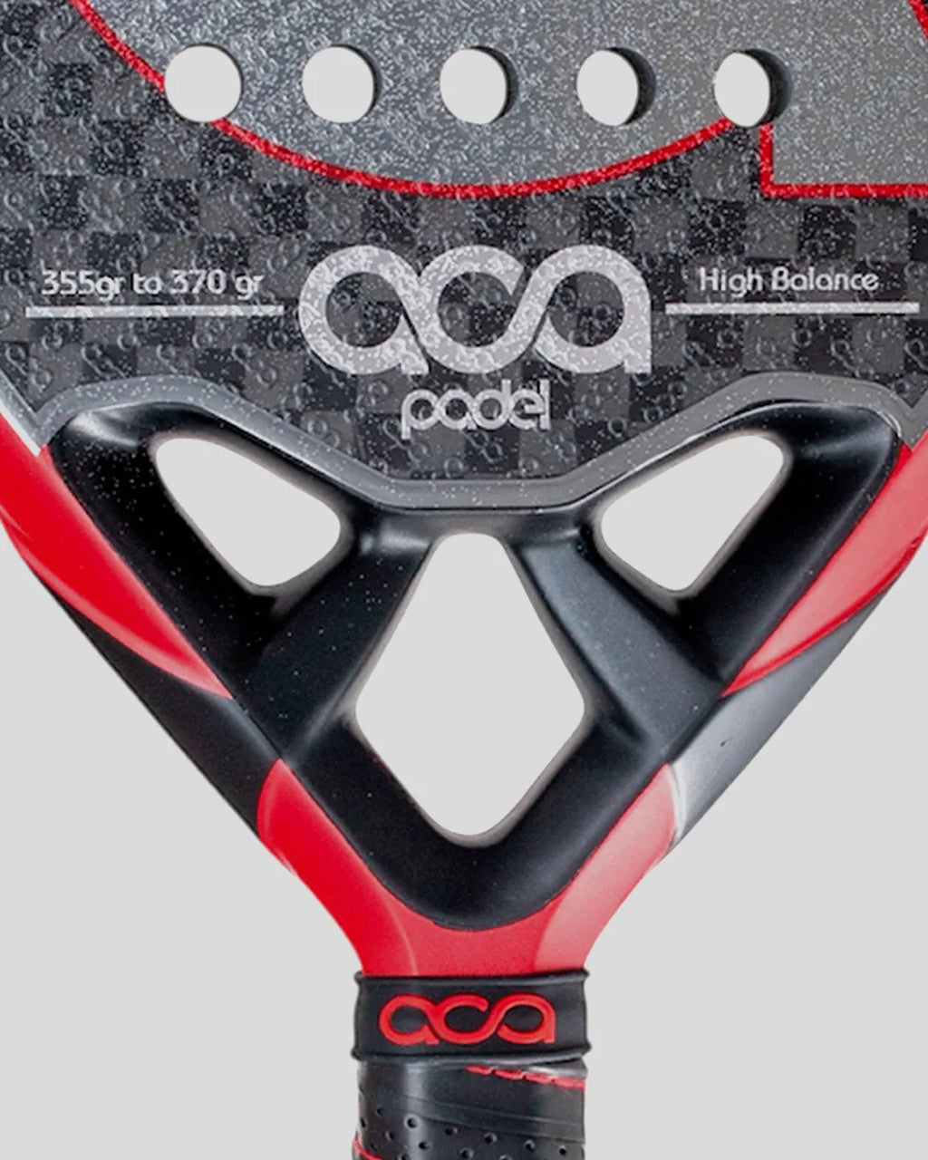 Close-up of a red and black ACA padel racket with branding on a gray background
