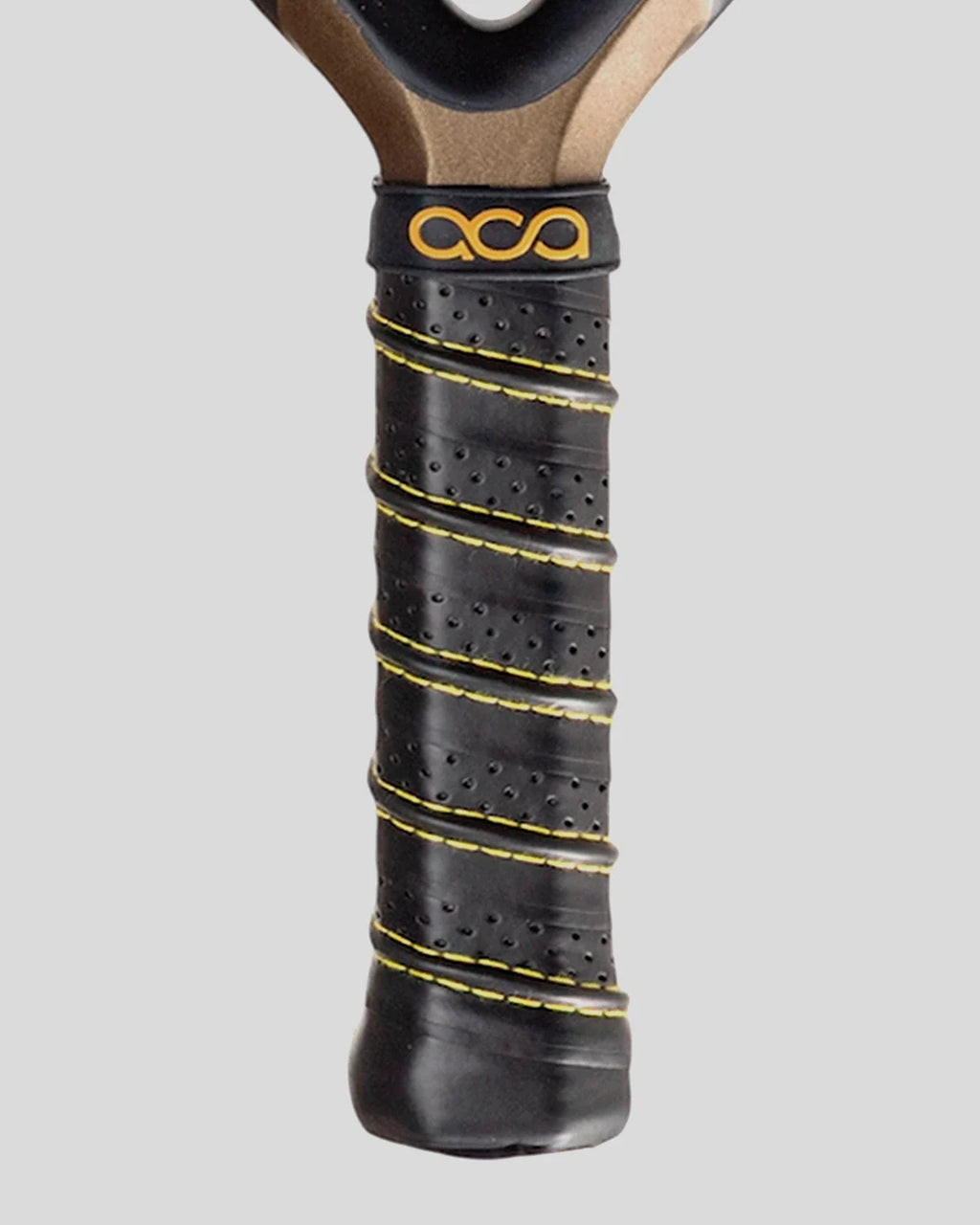 Close-up of a padel racket handle with black grip and yellow stitching on a gray background