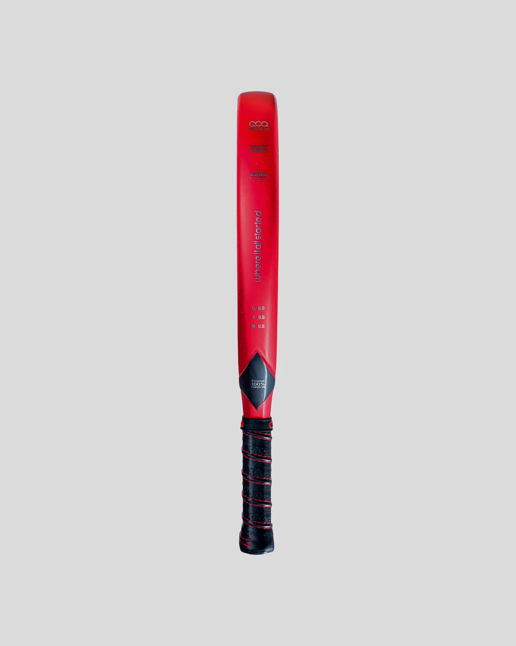 Red and black padel racket on a light gray background