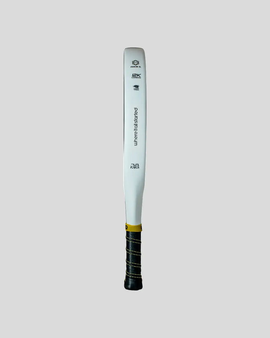 White padel racket with black and yellow grip on a light gray background