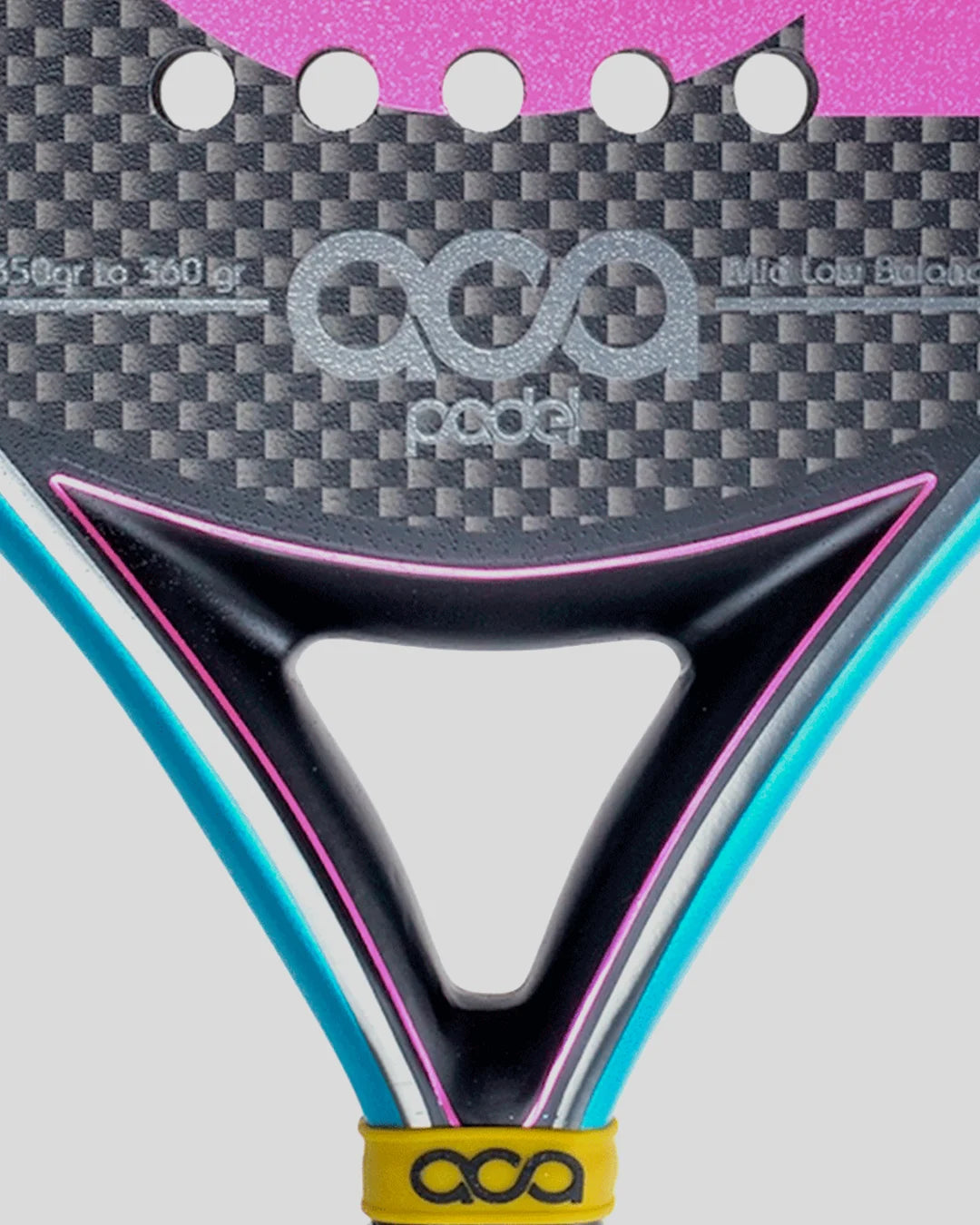 Close-up of a padel with 'ACA Padel' branding on a gray background