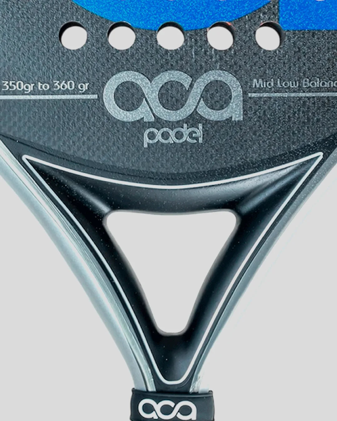 Close-up of a ACA Padel racket with branding and weight range details.